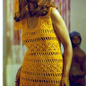 May include: A woman wearing a yellow crochet dress with a matching headband. The dress has a loose fit and a scoop neckline. The woman is smiling and looking to the side.