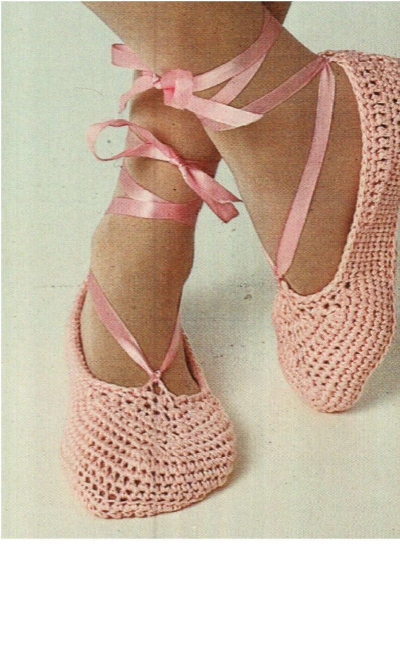May include: A pair of pink crocheted ballet slippers with pink satin ribbon ties.