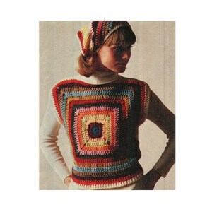May include: A colorful crochet top with a square design in the center. The top is made with different shades of red, orange, yellow, green, blue, and purple yarn. The top is paired with a white crocheted hat.