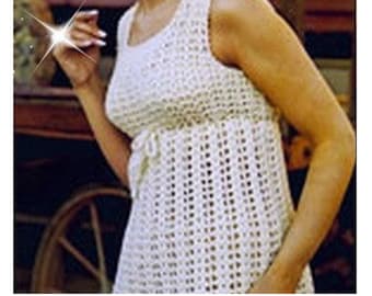 May include: A white crochet top with a sleeveless design and a tie at the waist.