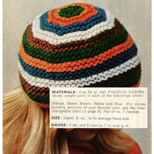 May include: A colorful striped knitted hat in orange, green, brown, white, and blue. The hat is made with bulky weight yarn and is 6 inches deep. The pattern is called "Pingouin Iceberg".