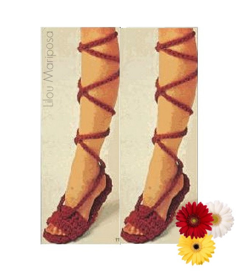 May include: Two images of a foot wearing a burgundy crochet sandal with wrap-around ankle ties. The sandals have a textured design on the footbed and a floral accent on the toe. The text "Lilou Mariposa" is in the upper left corner. Three colorful gerbera daisies are in the lower right corner.