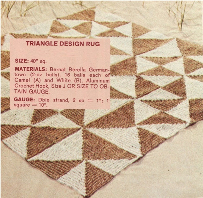 May include: A square, handmade rug with a triangle design. The rug is made of brown and white yarn, with each triangle section alternating in color. The text "TRIANGLE DESIGN RUG" is visible in the image. The rug measures 40 inches square.