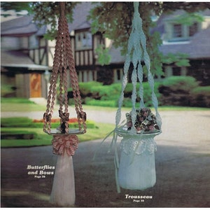 May include: Two macrame plant hangers, one pink and one light blue, hanging from tree branches. The pink hanger has a butterfly design and the text "Butterflies and Bows Page 30". The light blue hanger has a floral design and the text "Trousseau Page 30".