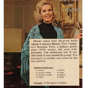 May include: A woman wearing a blue crocheted shawl. The text in the image reads "Lacy Shaw in Crochet" and includes instructions for making the shawl using Bernat Yarn Company's Dorlaine Yarn. The instructions include the yarn composition, hook size, gauge, and abbreviations for crochet stitches.