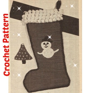 May include: A brown crocheted Christmas stocking with a white snowman and a white crocheted tree. The stocking has a white crocheted cuff.