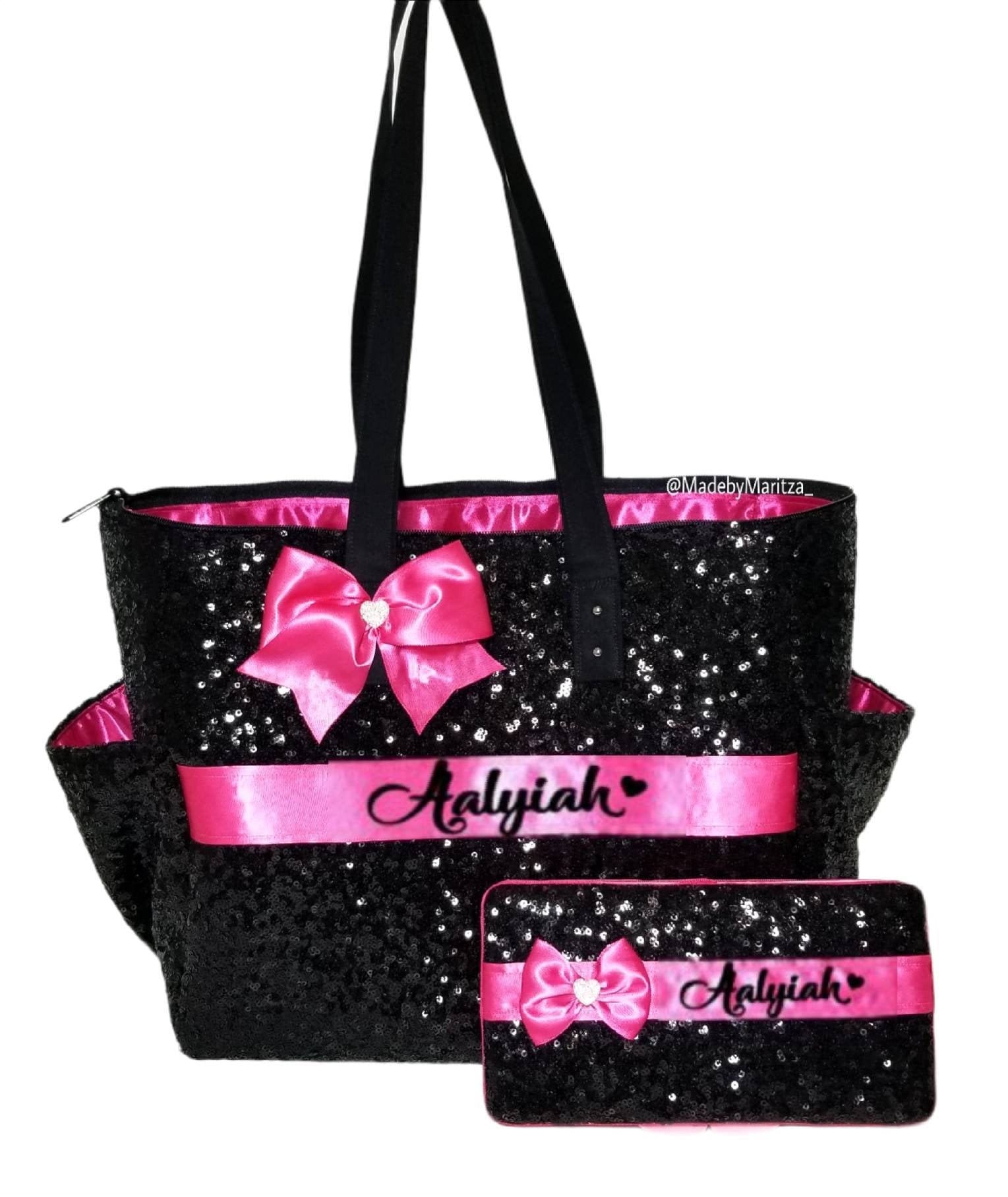 black and pink diaper bag