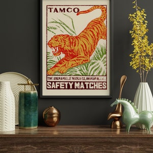 May include: Vintage style poster with a tiger illustration and the text "TAMCO THE ANAKAPALLE MATCH CO. ANAKAPALLE SAFETY MATCHES".