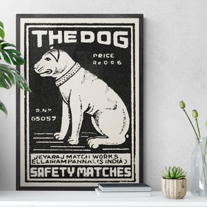 May include: Black and white vintage matchbox label with a dog illustration. The label reads "THE DOG", "PRICE Re 0 0 6", "R.N.P. 65057", "JEYARAJ MATCH WORKS. ELLAIRAM PANNAI. (S INDIA)", and "SAFETY MATCHES".