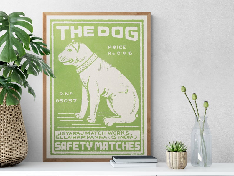 May include: A vintage green and white matchbox label with a white dog illustration and the text "THE DOG", "PRICE Re 0 0 6", "R.NO 65057", "JEYARAJ MATCH WORKS. ELLAIRAM PANNAI. (S INDIA)", and "SAFETY MATCHES".