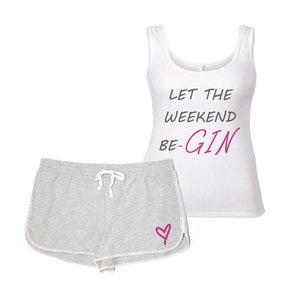 May include: A white tank top and gray shorts pajama set. The tank top has the text "LET THE WEEKEND BE-GIN" in black and pink. The gray shorts have a pink heart graphic.
