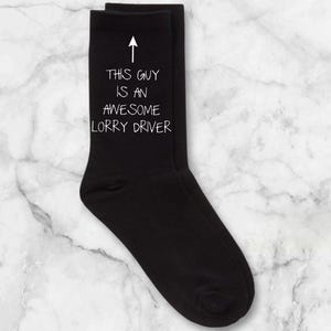 May include: Black socks with a white arrow and the text "This guy is an awesome lorry driver" printed on them.