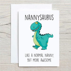 May include: A white card with a green dinosaur illustration and the text "NANNYSAURUS LIKE A NORMAL NANNY, BUT MORE AWESOME".