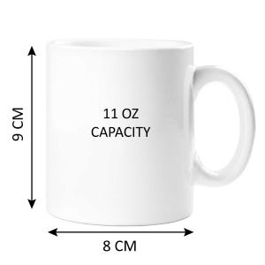 May include: White ceramic mug with a black inscription that reads "11 oz CAPACITY". The mug is 9 inches tall and 8 inches wide.