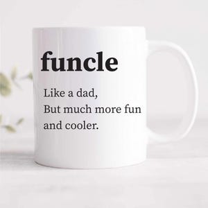 May include: White ceramic mug with black text that reads "funcle" and the definition "Like a dad, But much more fun and cooler."