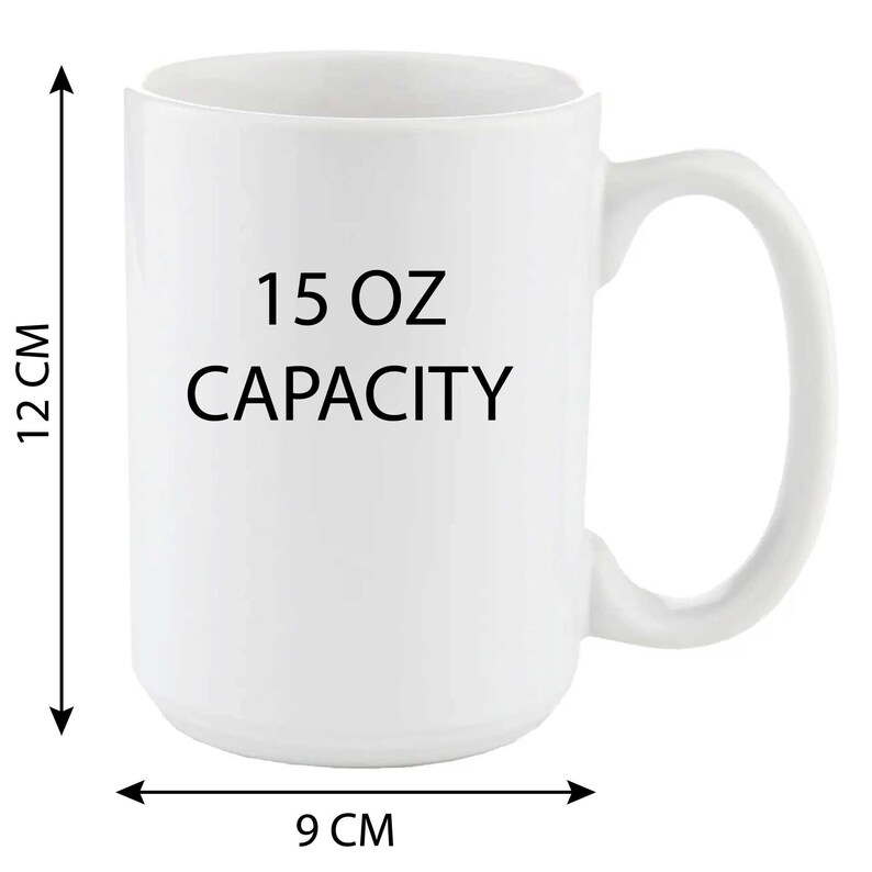 May include: White ceramic mug with a black inscription that reads "15 OZ CAPACITY". The mug has a handle and is 12 inches tall and 9 inches wide.