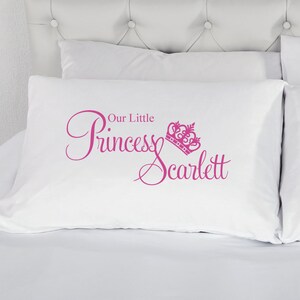 May include: White pillowcase with pink text that reads "Our Little Princess Scarlett" with a pink crown graphic.