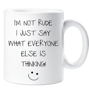 May include: White ceramic coffee mug with black text that reads "I'm not rude I just say what everyone else is thinking!" and a smiley face.