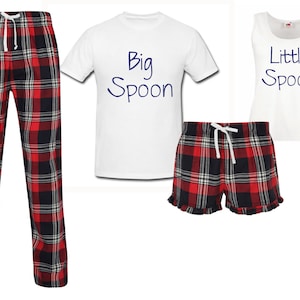 May include: A matching pajama set with a red and black plaid pattern. The set includes a t-shirt with the text "Big Spoon" and a tank top with the text "Little Spoon".