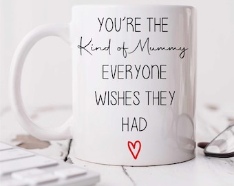 May include: White ceramic mug with black text that reads "You're the kind of Mummy everyone wishes they had" with a red heart at the bottom.