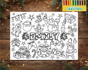 May include: A black and white Christmas-themed colouring page featuring the name "EMILY" surrounded by festive illustrations including Santa Claus, a snowman, gifts, and ornaments. A box of 10 wax crayons is in the upper right corner.