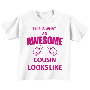 Cousin TShirt This Is What An Awesome Cousin Looks Like White Tshirt Pink TEXT Kids Sibling Text Children New Born Gift Present