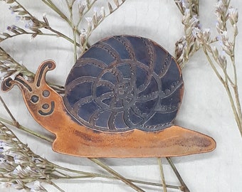 Snail brooch in etched and oxidised pure copper