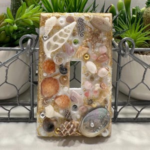 May include: A rustic wooden sign with the text "Welcome to our home" in white lettering. The sign features a distressed finish and a simple, inviting design, perfect for a front porch or entryway.