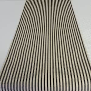 May include: A black and white striped table runner. The runner is made of a woven fabric and has a subtle texture.