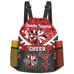 May include: Red and black drawstring backpack with the words "Team Name" and "CHEER" printed on it. The bag features a glittery red background with cheerleading graphics and two side pockets for water bottles.