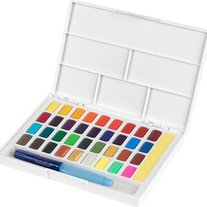 May include: A white watercolor paint set with a variety of vibrant colors. The set includes a water brush and a yellow sponge. The paint colors are arranged in a white plastic case with a lid.