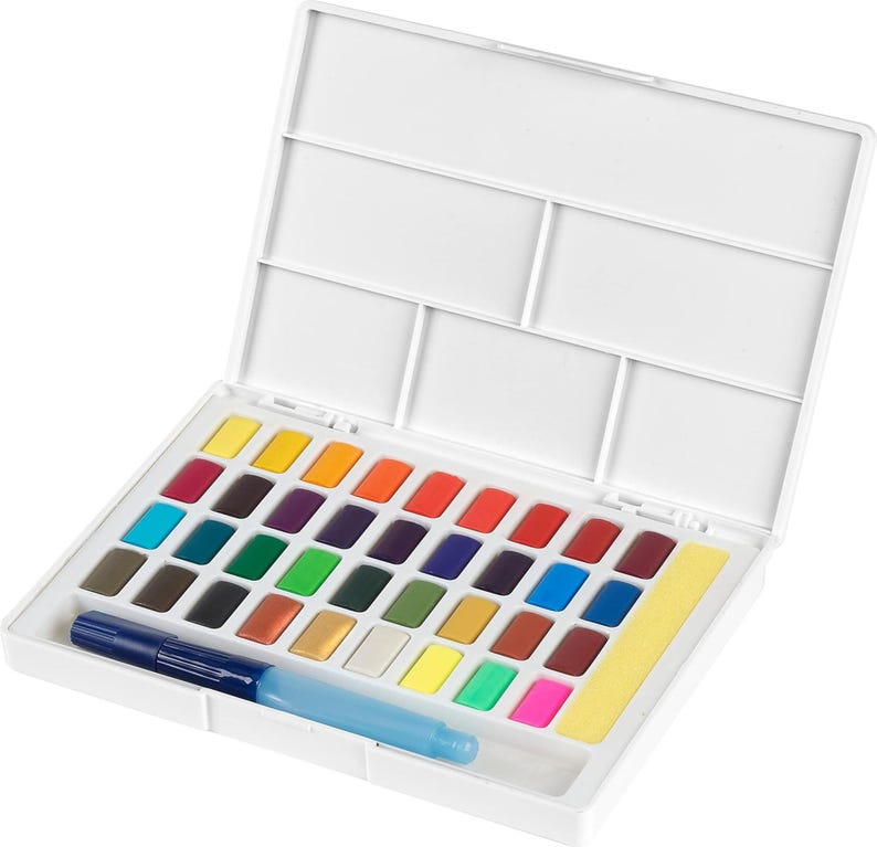May include: A white watercolor paint set with a variety of vibrant colors. The set includes a water brush and a yellow sponge. The paint colors are arranged in a white plastic case with a lid.