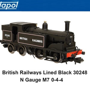 May include: Black model train engine with "BRITISH RAILWAYS" written on the side. The engine is numbered 30248 and is an N Gauge M7 0-4-4.