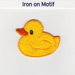 May include: Yellow iron-on patch of a rubber ducky. The duck is facing left and has a small orange beak and black eyes.