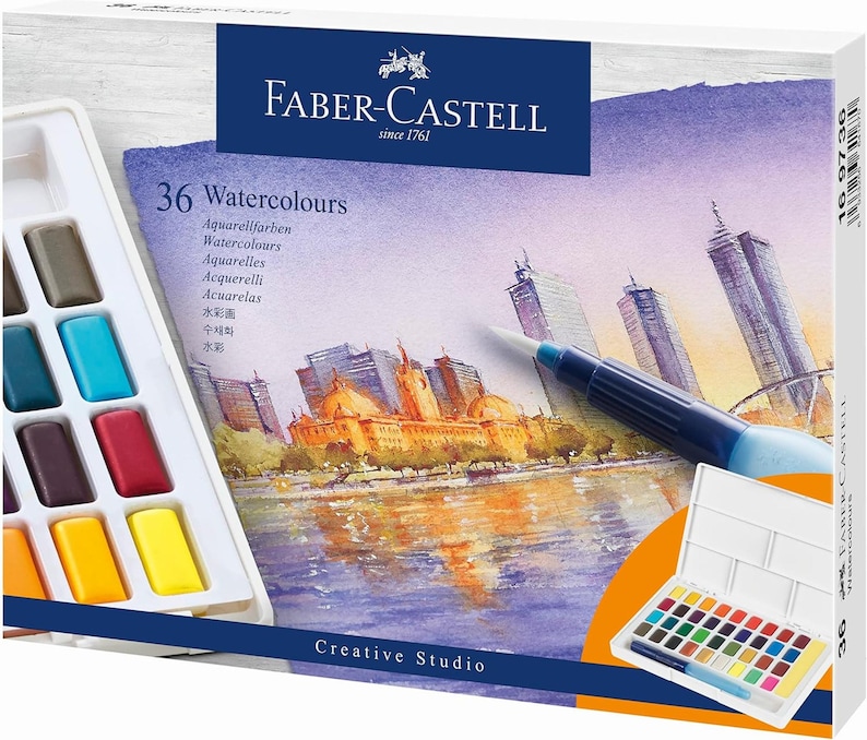 May include: A Faber-Castell watercolor paint set with 36 colors. The box features a cityscape painting and a watercolor brush. The set includes a palette of vibrant colors, perfect for creative studio projects. The box is white with the Faber-Castell logo.
