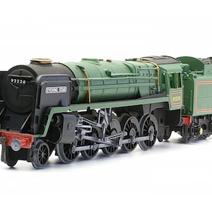 May include: A model of the 'Evening Star' steam locomotive, painted in green and black. The model displays the number 92220 and features detailed components such as wheels, pipes, and the name "EVENING STAR".