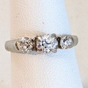 14k white gold ring, 3 diamonds, center stone .50 carat weight, .85 TCW; size 5 3/4 US