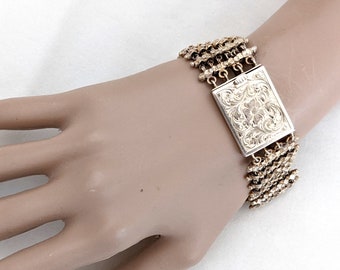Hand wrought gilt silver link bracelet, engraved floral and foliate clasp motif, 7 5/8 inches long, 60.2 grams.