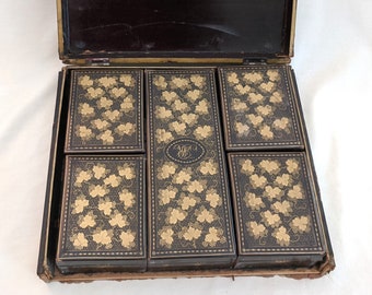 Late 18th century Chinese export game set; hand lacquered boxes, 57 engraved mother-of-pearl counters; 'MR' mongram; boxes need repair