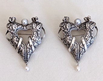 Pair of "Raine" sterling and pearl matching heart shape brooches; 1 3/4 H inches; 45 grams