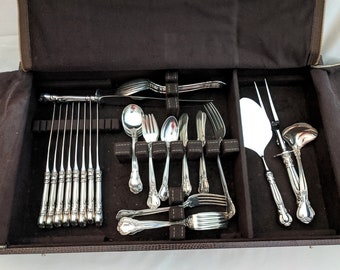 Boxed 59 piece partial set of Gorham &#39;Chantilly&#39; sterling flatware and serving pieces; 1,855 grams - weighable pieces