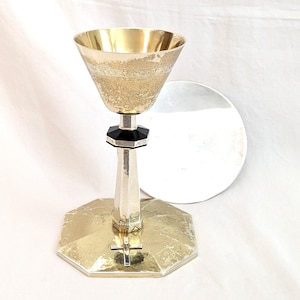 May include: A set of three ceramic mugs with a speckled, matte finish. The mugs are in shades of cream, light gray, and dark gray. Each mug has a simple, minimalist design, perfect for coffee or tea.