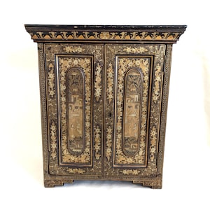 A Chinese Two Door Black Lacquered Table Top Chest A Chinese Two Door Black Lacquered Table Top Chest