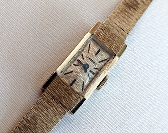14k gold Swiss Longines ladies wristwatch and band; 6 1/4 inches long; working