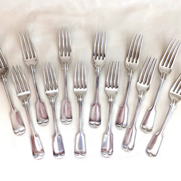 12 Lincoln & Reed of Boston coin silver Fiddle and Thread dinner forks; 7 5/8 inches long; 720 grams total weight