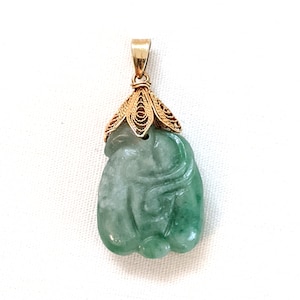 14k gold mounted, hand carved green jadeite pendant; 1 1/8 inches total length, 3.9 grams