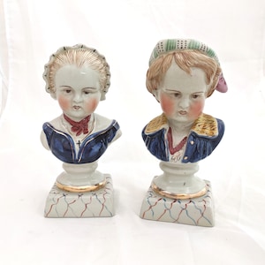 Pair of Victorian English Staffordshire porcelain busts of children