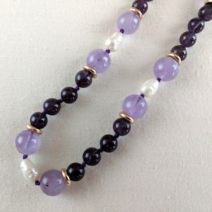 38 inch long two toned amethyst, baroque pearl, 14k gold beaded necklace; individually knotted, no clasp