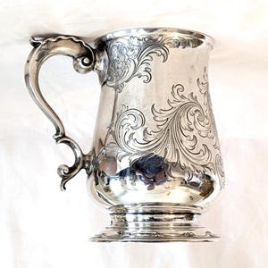 Georgian sterling English tankard, fine chase work, &#39;EM&#39; monogram, 5 1/4 high inches, 1784 London, John Denzilow, 375 grams