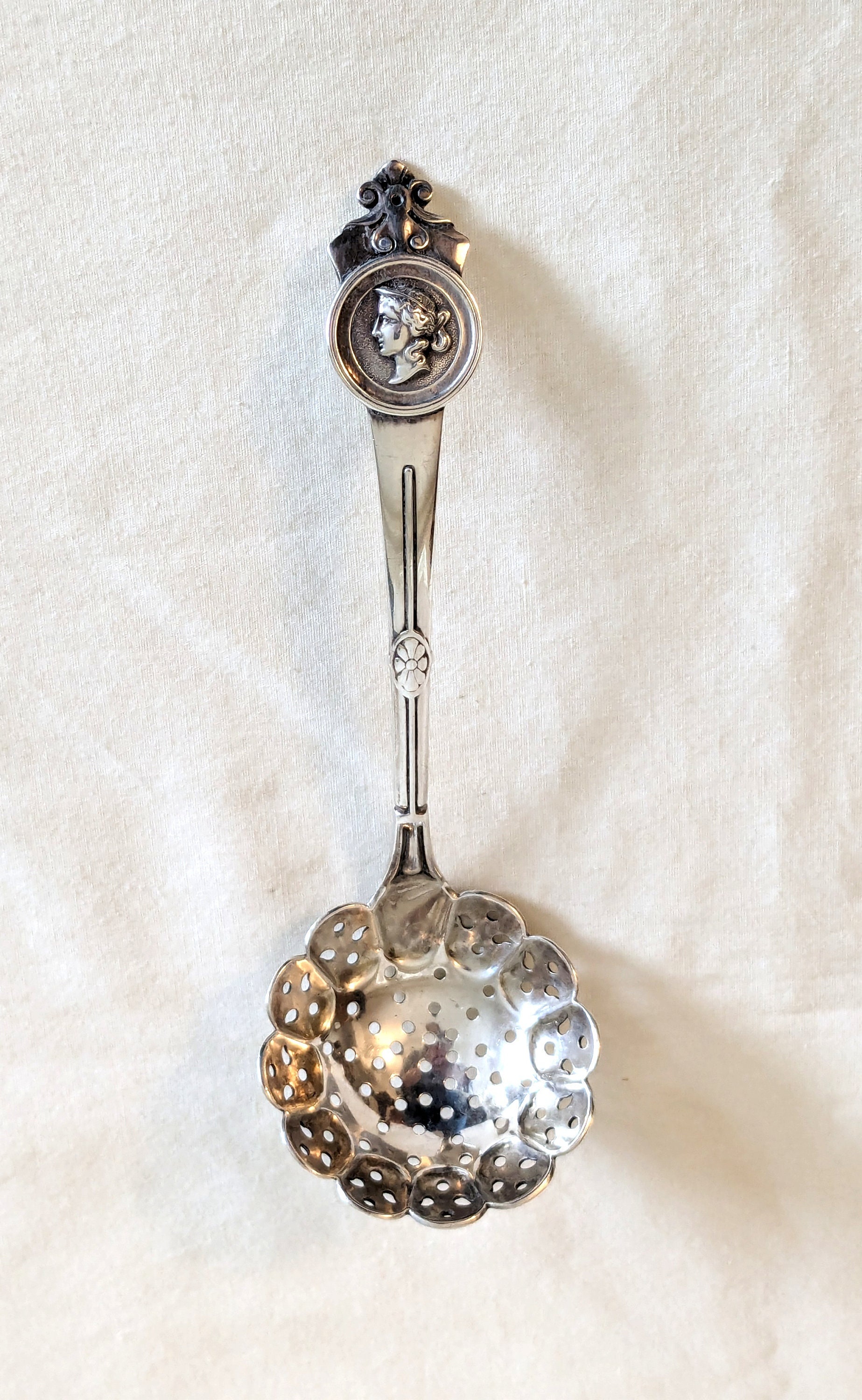 Gorham 'Medallion' sterling, pierced small ladle made for Tiffany & Co, 6 3/8 inches long, 40 grams